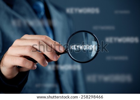 Find keywords concept. Marketing specialist looking for keywords (concept with magnifying glass).