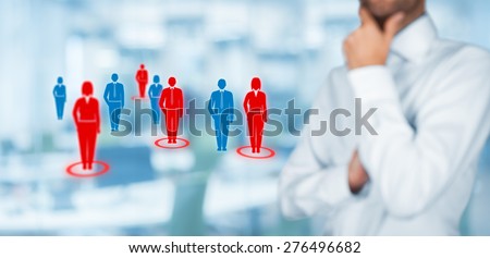 Target audience (marketing) concept. Businessman think about target audience and customers. Wide composition, office in background.