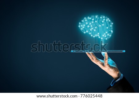 Artificial intelligence (AI), machine deep learning, data mining and another modern computer technologies concepts. Brain representing artificial intelligence and businessman holding futuristic tablet