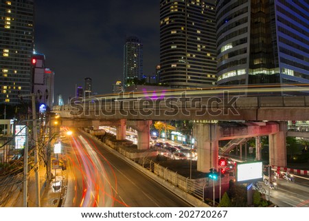 BANGKOK - 21 JUNE : Bangkok at Sa-thorn junction. It is the many people and car move on road on June 21, 2014 in Bangkok, Thailand.