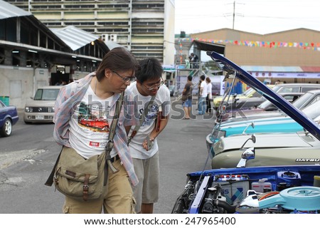THAILAND - APRIL 5: An unidentified men visit retro car motor show on April 5, 2014 in Bangkok, Thailand. The festival is meeting retro car user of Thailand.