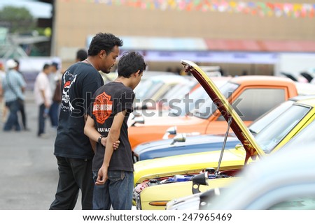 THAILAND - APRIL 5: An unidentified men visit retro car motor show on April 5, 2014 in Bangkok, Thailand. The festival is meeting retro car user of Thailand.