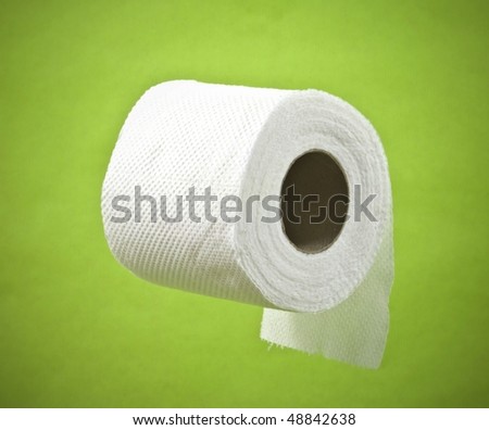 roll of toilet paper on a green background