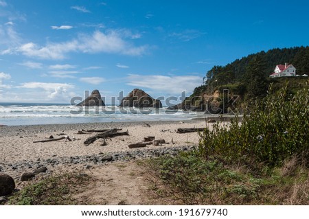 The beach at Haceta Head, the Oregon coast. Keeper of the lighthouse home in upper right.
