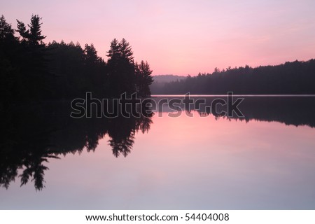 Sunrise over a lake in Algonquin Provincial Park in Ontario, Canada.