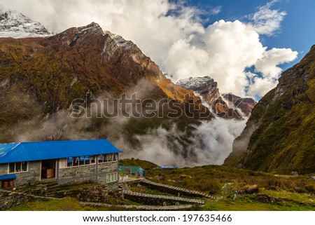 Clouds coming from mountains at the Machapuchare Base Camp, Himalayas, Nepal