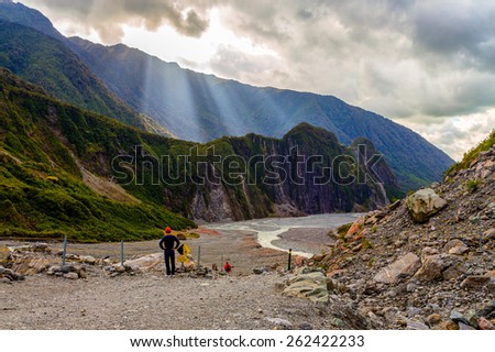 God rays in Fox glacier valley in South Alps, South island of New Zealand