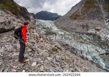 Hiking by the Fox glacier in South Alps, South island of New Zealand