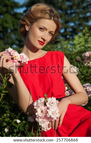 beautiful girl in the garden of roses