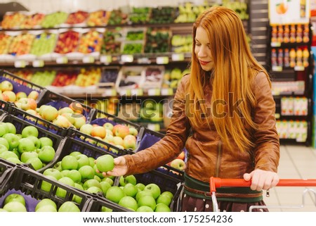Red Haired Beauty Shopping For Fruit