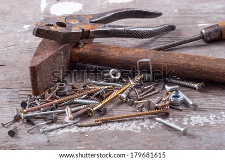 Different old tools, laying on old wood. All in close up.