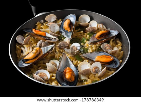 Fideua is a very popular traditional main course similar to Paella. It is made with noodles instead of rice.