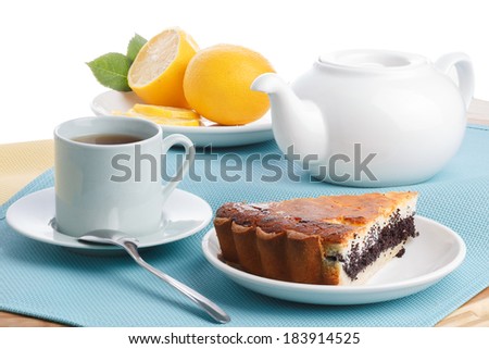 Cake slice with tea. Pie with poppy and cheese. Healthy breakfast