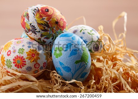 Colorful painted easter eggs on a elegant openwork dish