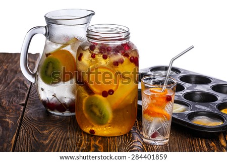 Preparation of bulk party drinks with frozen fruits and berries. Clean eating