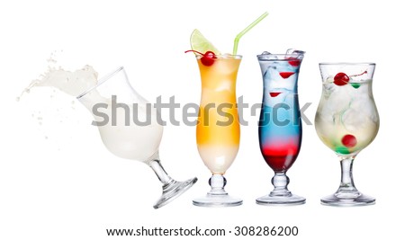 Colorful and spectacular alcoholic cocktails in hurricane glasses