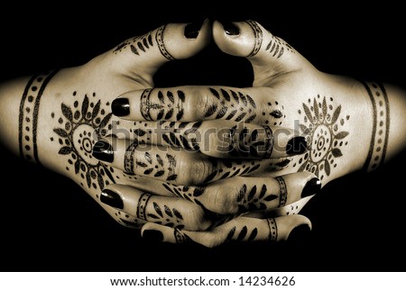 stock photo : Nice closeup women's hands with oriental tattoo isolated over 