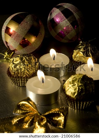 Nice golden Christmas decorations with lights in a darkness