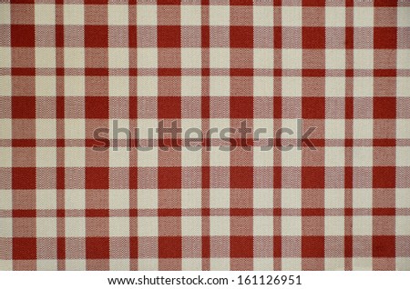 Squared fabric in red and white. Cloth and textile repetitive background
