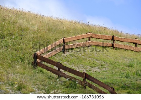 Wooden fence in the hill of a mountain. Farm concept