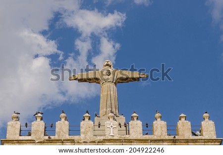 Stone statue of Jesus Christ in te top of the church of Fuentecen, Burgos, Castilla y Leon, Spain