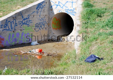Dirty urban culvert. Drainage pipe. Ecology and environment concept