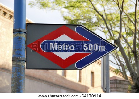 Metro sign in Madrid, Spain. Subway is near. 500 m