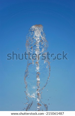 Water spurt of a fountain. Water in motion and flowing