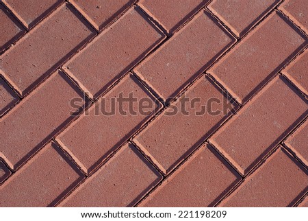 Urban ground made with red cobbles. Street floor