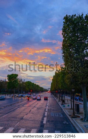 Traffic and tourists  in Champs Elysees Boulevard at sunset