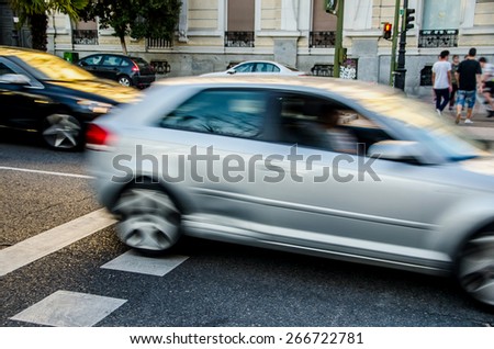 Traffic. Urban scene with cars in motion.