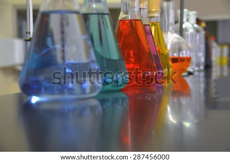 Chemical laboratory table with some flasks and jars