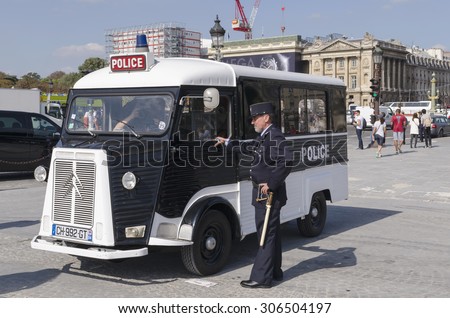 PARIS, FRANCE - september 16, 2014: National Police wearing and old uniform for tourists in Place de la Concorde. The National Police is also known as the Surete nationale.