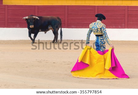 A bullfighter awaiting for the bull in the bullring. Corrida de toros