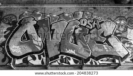 LONDON, UK / CIRCA JUNE 2014 - Black & White picture of great graffiti made by unknown artist seen on Leake Street public gallery