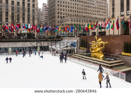 NEW YORK, USA / 08.02.2015 - Unknown people skating on ice ring at Rockefeller Center