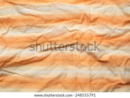 the wrinkled of clothes pattern orange color for background