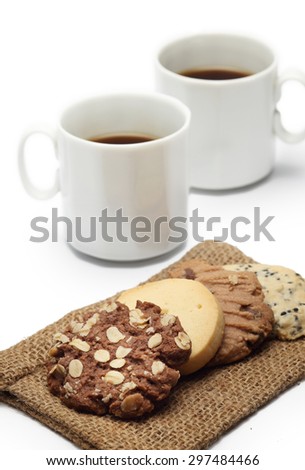 The many cookies on sack and coffee cup set for relax and break from meeting on white background