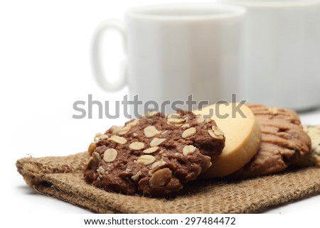 The many cookies on sack and coffee cup set for relax and break from meeting on white background