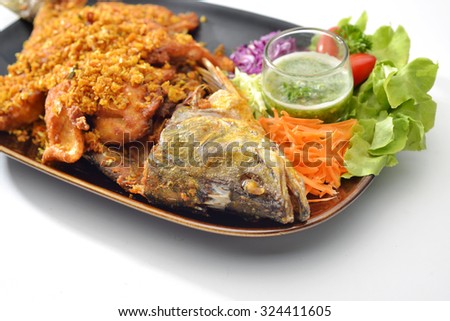 Sea Fish Fried with garlic and pepper eat together with Thai Seafood Sauce