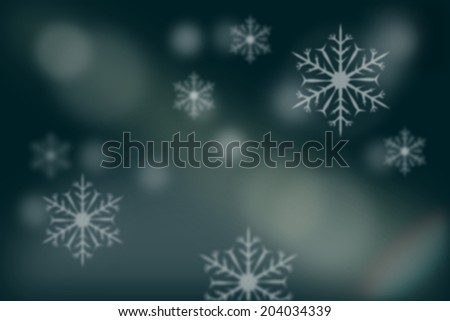 Abstract blurry background of snowflakes over blurry snow land