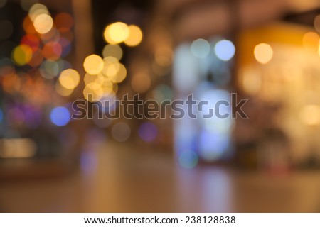 Abstract blurry dark indoor plaza hall with a lot of small bokeh