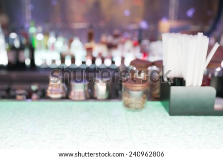 Abstract blurry empty drink counter restaurant with a bunch of straw over counter