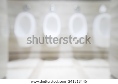 Abstract blurry clean men urinate bowl inside public rest room