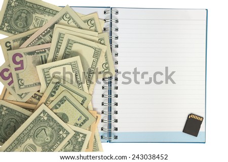 Dollar notes all over one side of paper notebook and sd card on another side of book