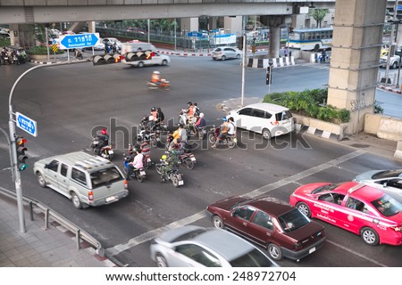 Bangkok, Thailand - January 30, 2015 :  Various vehicles break law by stop car beyond the white line on the ground during red light.