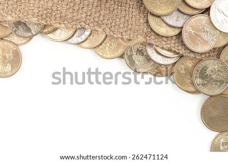 Group of one dollar coins copyspace over used old sack white background