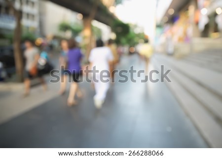 Abstract blurry scene of rush hour in business area of Bangkok with blurry unrecognizable people