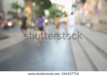 Abstract blurry scene of rush hour in business area of Bangkok with blurry unrecognizable people