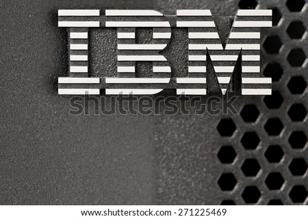 Bangkok, Thailand - March 19, 2015: Closeup of silver IBM logo over huge pSeries server black color rack lid mesh